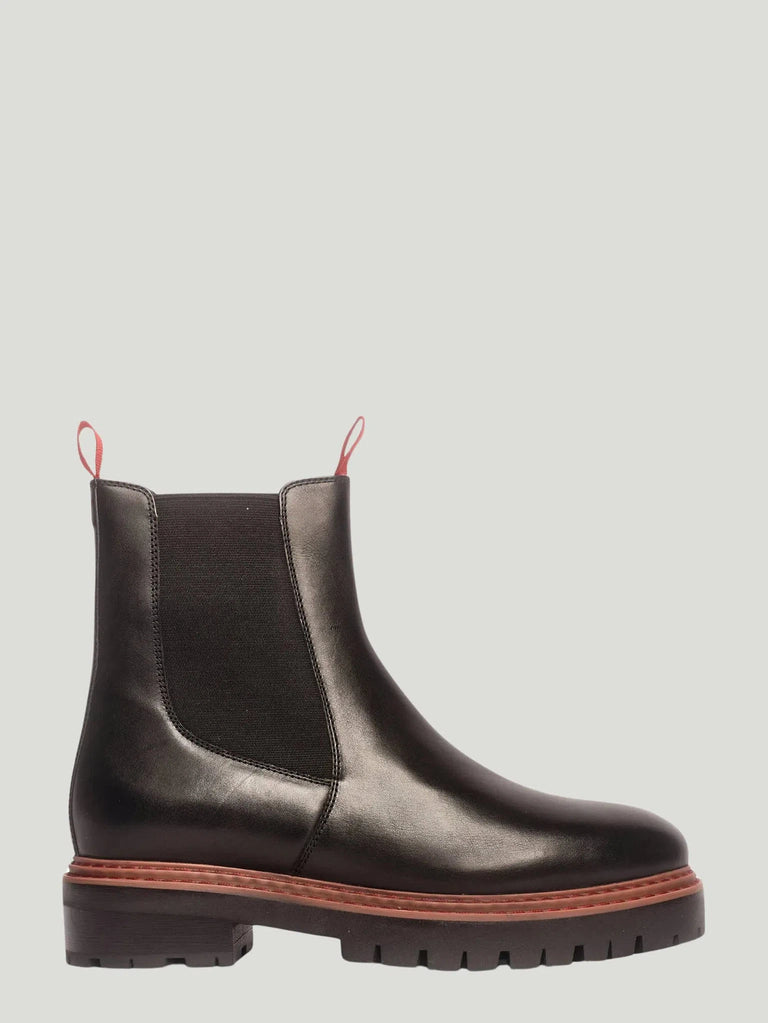 Discover the Anthony Veer Olivia Chelsea Boot at Queen Anna House of Fashion. A unique fusion of classic Chelsea and combat boot styles with a chic chunky heel and striking red hand ties. Perfect for any weather and occasion. Shop now for a sophisticated update to your footwear collection.