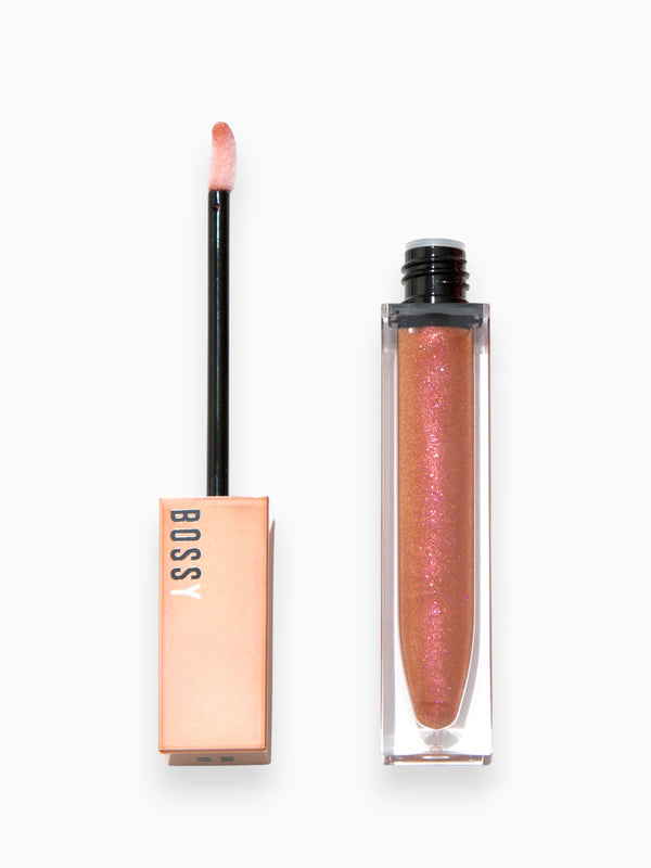 Lip gloss with applicator and packaging on a white background