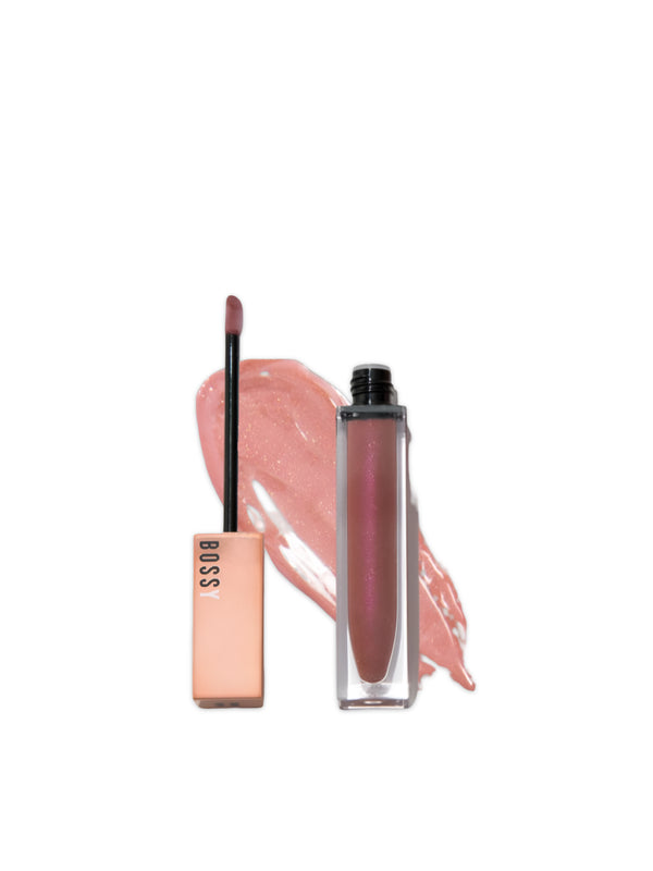 Lip gloss with applicator on a white background