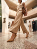 CHRISTINA LOMBARDI Kersen tan suede pointed-toe pumps with ankle strap detail.