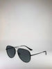 Black sunglasses on a light gray background