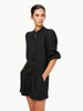Woman wearing a black outfit on a white background