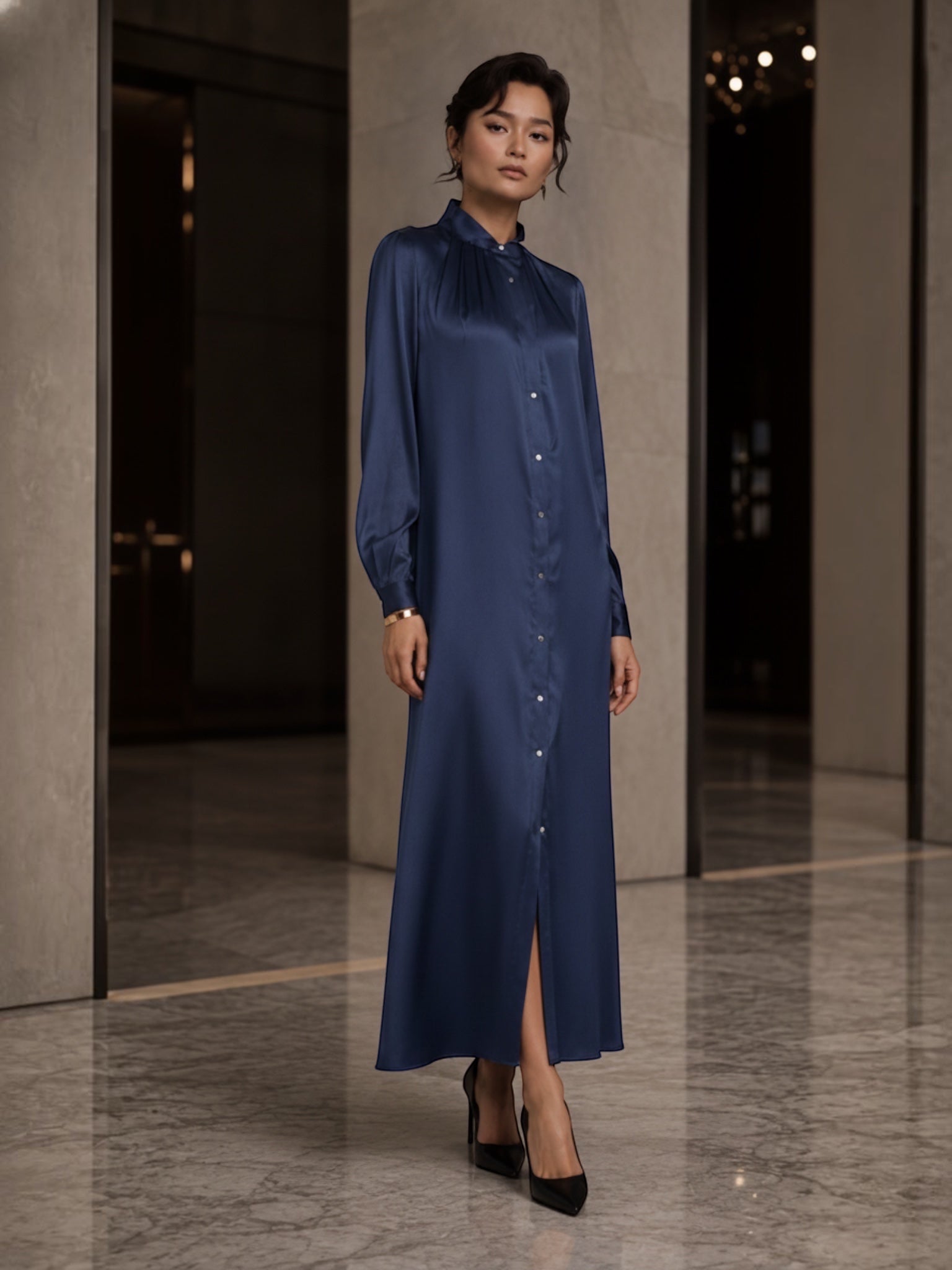 The Camilla Dress by Neu Nomads is constructed from 100% Satin TENCEL™ Modal, with a refined polo collar, long sleeves, and a button-up shirt dress silhouette featuring a 2-inch belt. Biodegradable mother-of-pearl shell buttons and French seam finishing complete the garment.