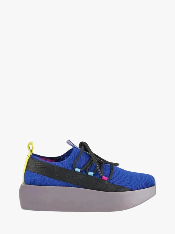 Blue and black sneaker with a yellow tag on a gray background