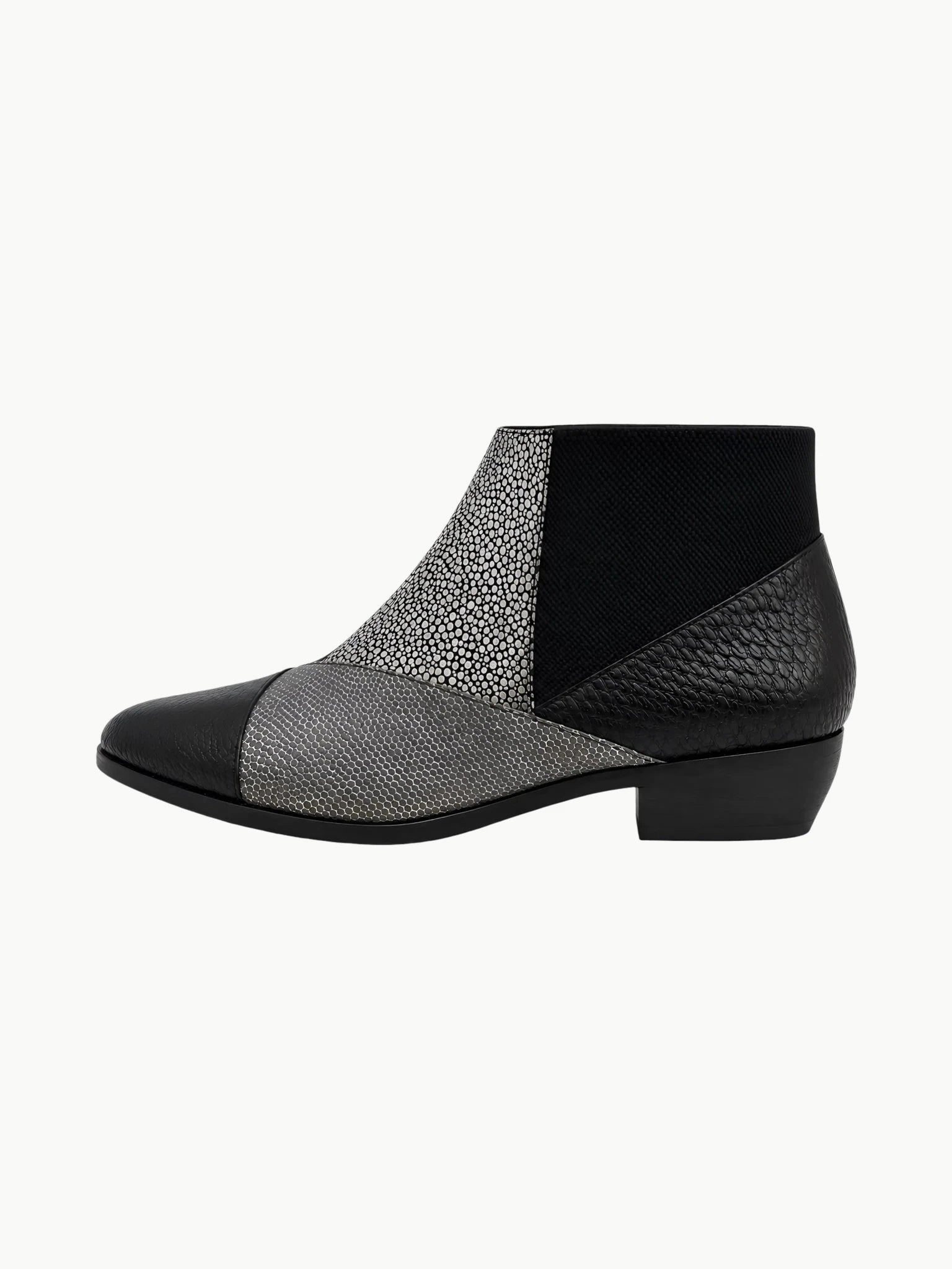 United Nude Zink Patch Booties: architectural black and silver mixed-texture leather ankle boots with a pointed toe.