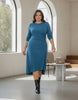 Model wearing a blue Queen Anna House of Fashion jersey cinched dress with a high-low hem and three-quarter sleeves.