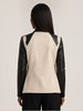 Blanc Noir Drape Front Jacket in taupe with black contrast sleeves, back view on model