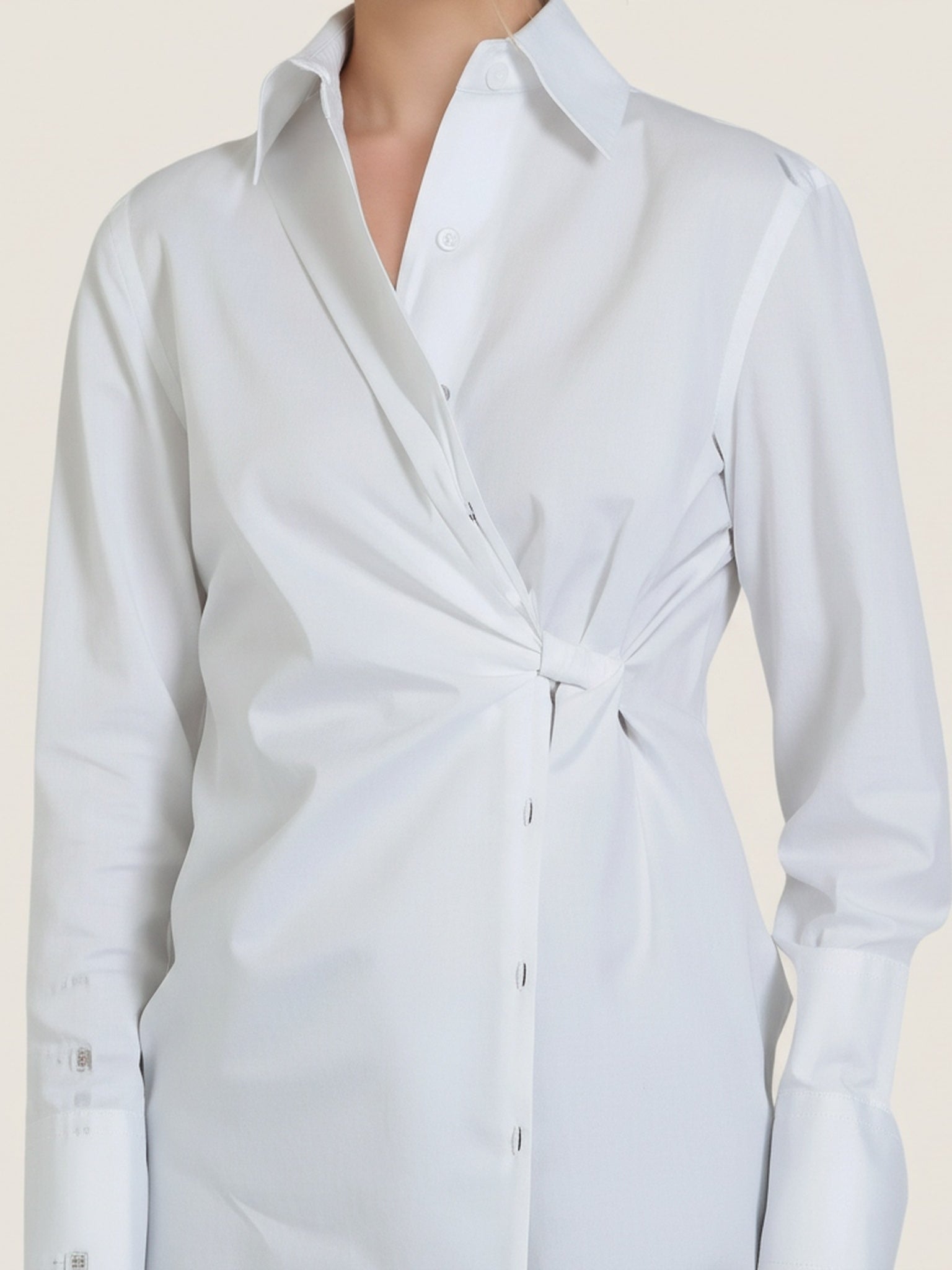 Close-up of Article X White The Wrap Button Down Shirt detailing the waist tie and collar design