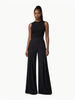 Model standing in Article X Black Wide Leg Pant and sleeveless black top, front product shot