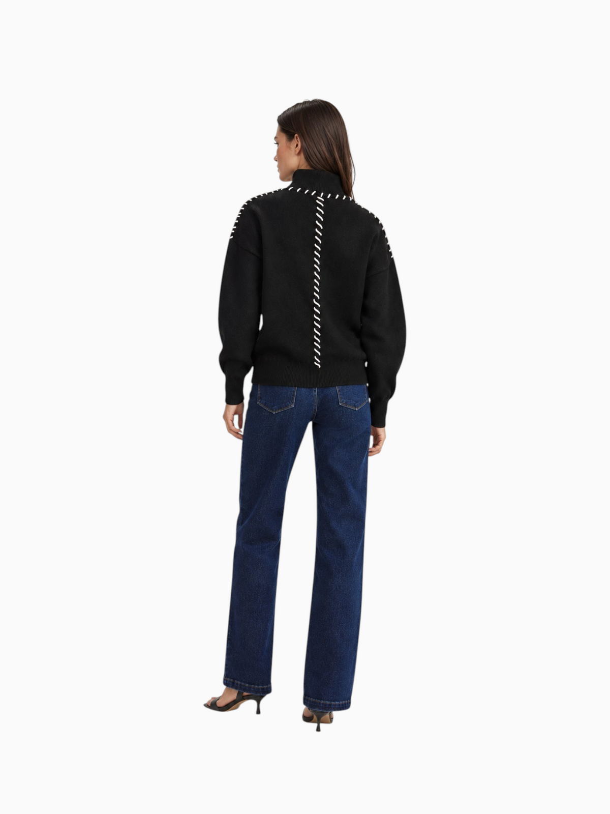Queen Anna House of Fashion black knit sweater with white contrast stitching worn by a model with dark blue jeans