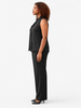 Queen Anna House of Fashion model wearing a black Universal Standard Brava sleeveless cupro blouse and trousers.