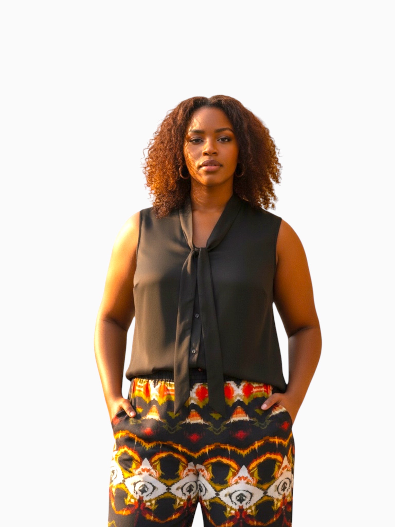 Queen Anna House of Fashion model wearing a black sleeveless Universal Standard Brava cupro blouse with a tie neck