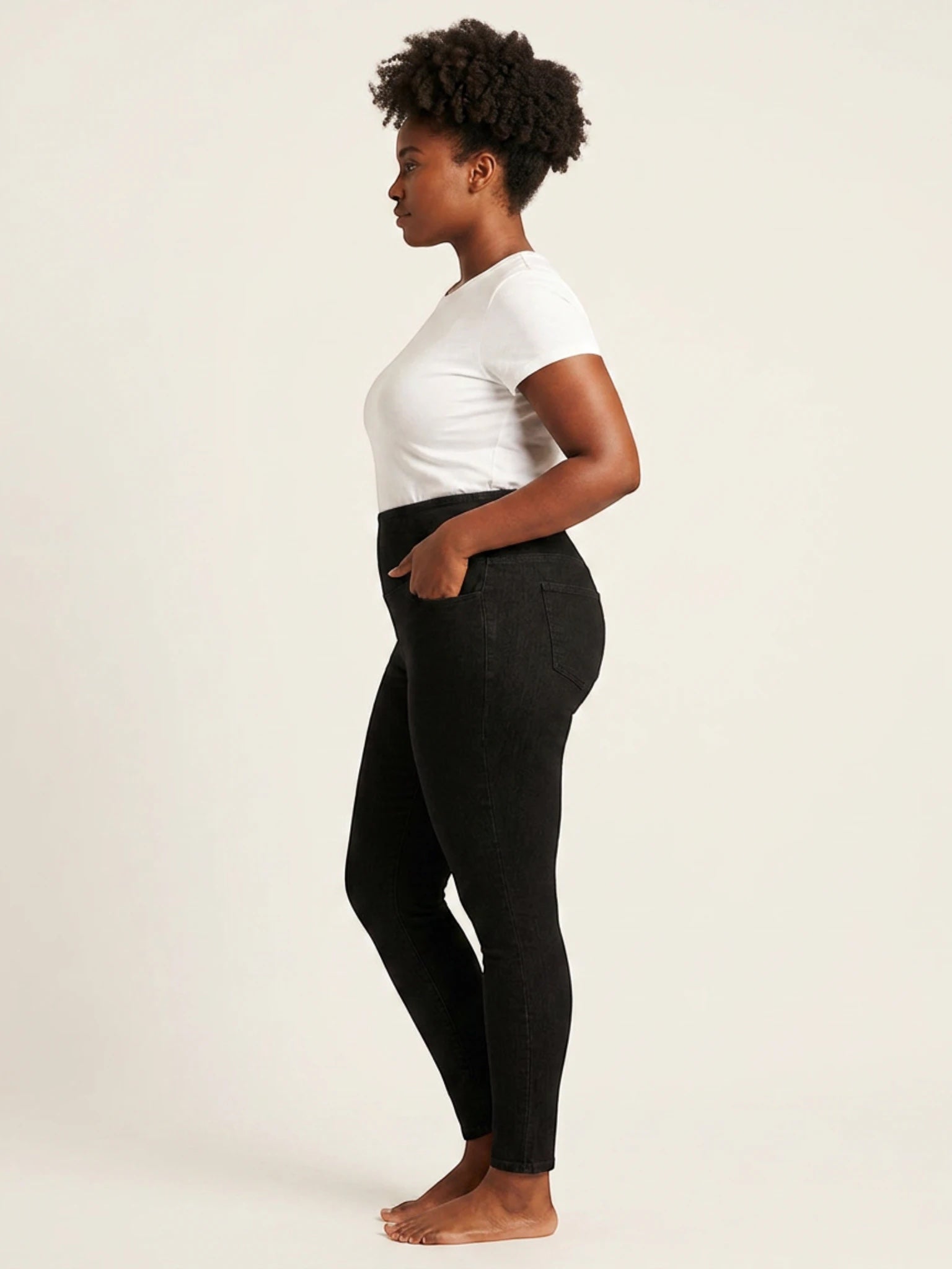 Queen Anna House of Fashion Yummie black denim shaping leggings on a model, side profile view.