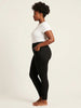 Queen Anna House of Fashion Yummie black denim shaping leggings on a model, side profile view.