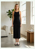 Queen Anna House of Fashion black sleeveless knit midi dress with a round neckline worn by a model in a bright room.