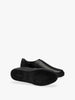 Queen Anna House of Fashion black leather utilitarian minimal sneakers with a sleek silhouette and durable sole.
