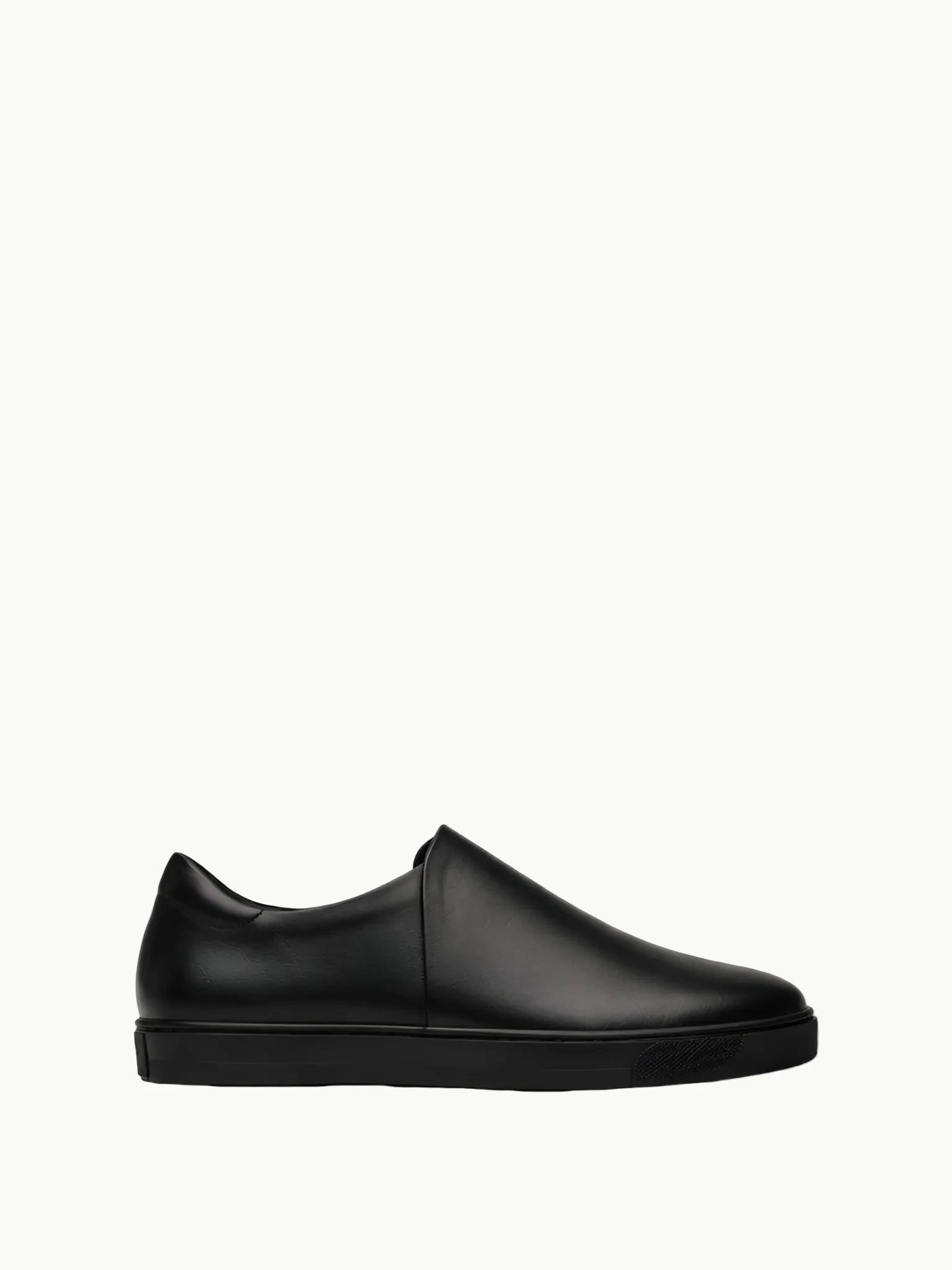 Queen Anna House of Fashion black leather minimalist slip-on sneakers with a sleek, modern design and durable rubber sole.