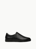 Queen Anna House of Fashion black leather minimalist slip-on sneakers with a sleek, modern design and durable rubber sole.