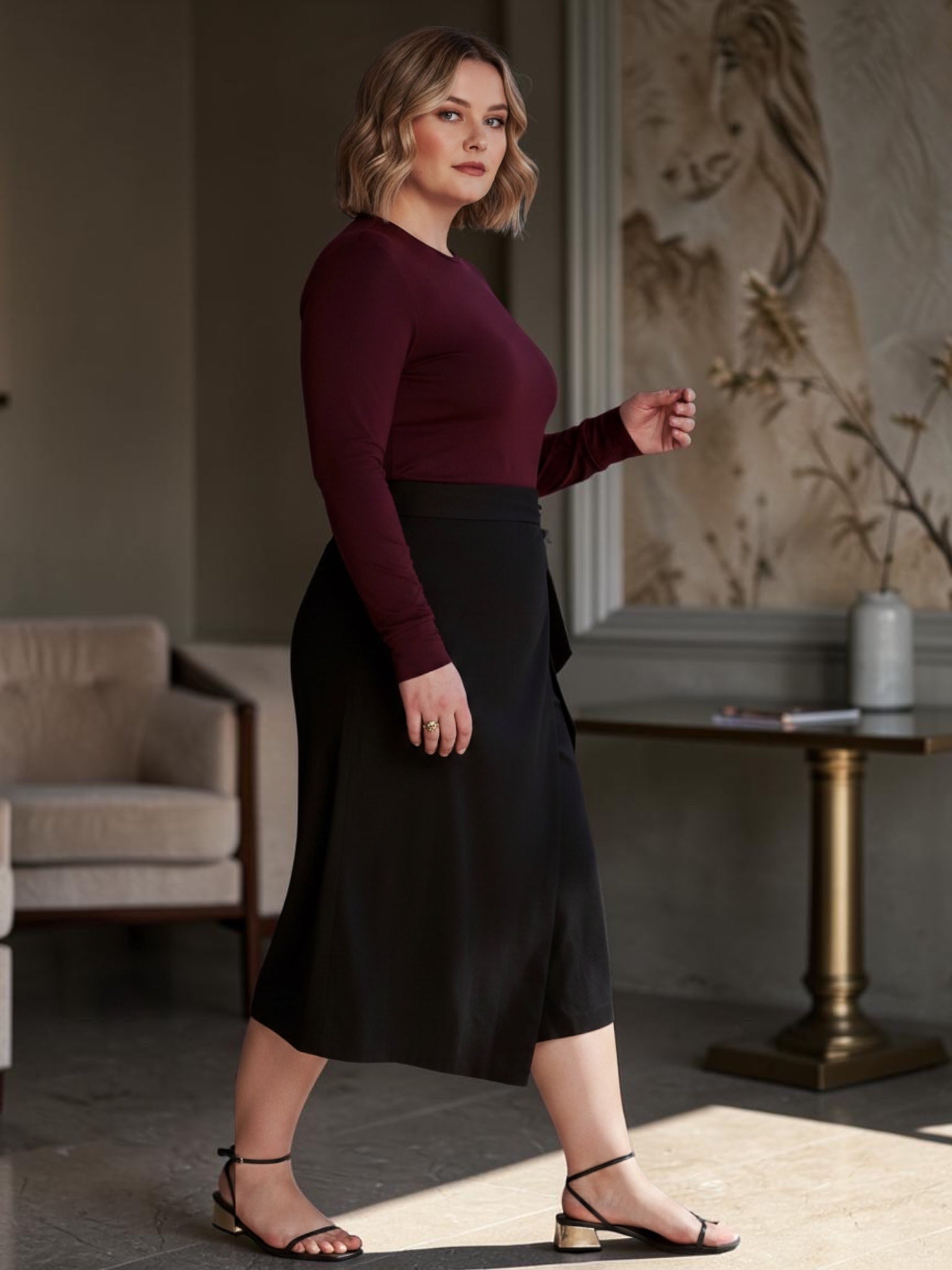 Queen Anna House of Fashion black linen wrap culottes with a wide-leg cropped fit worn by a model in a modern room.