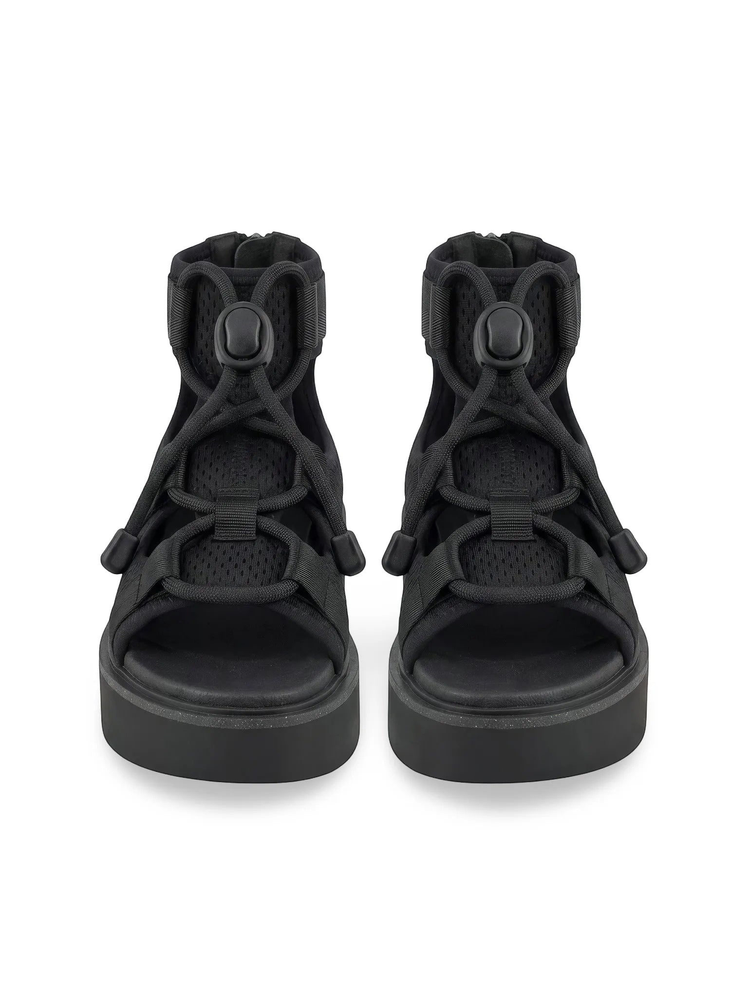 Queen Anna House of Fashion black Nappa leather and neoprene Nomadic Lo sandals with adjustable velcro ankle strap and foam rubber outsole.