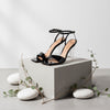 Queen Anna House of Fashion black patent leather sandals with transparent lucite block heel and ankle strap.