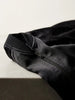 Queen Anna House of Fashion black satin bomber jacket featuring tonal ribbed collar and zip closure detail.