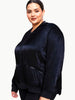 Queen Anna House of Fashion model wearing a black satin bomber jacket with zip pockets and tonal rib trim