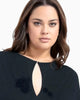 Queen Anna House of Fashion model wearing a black Universal Standard Divine Jersey shift dress with a keyhole neck.