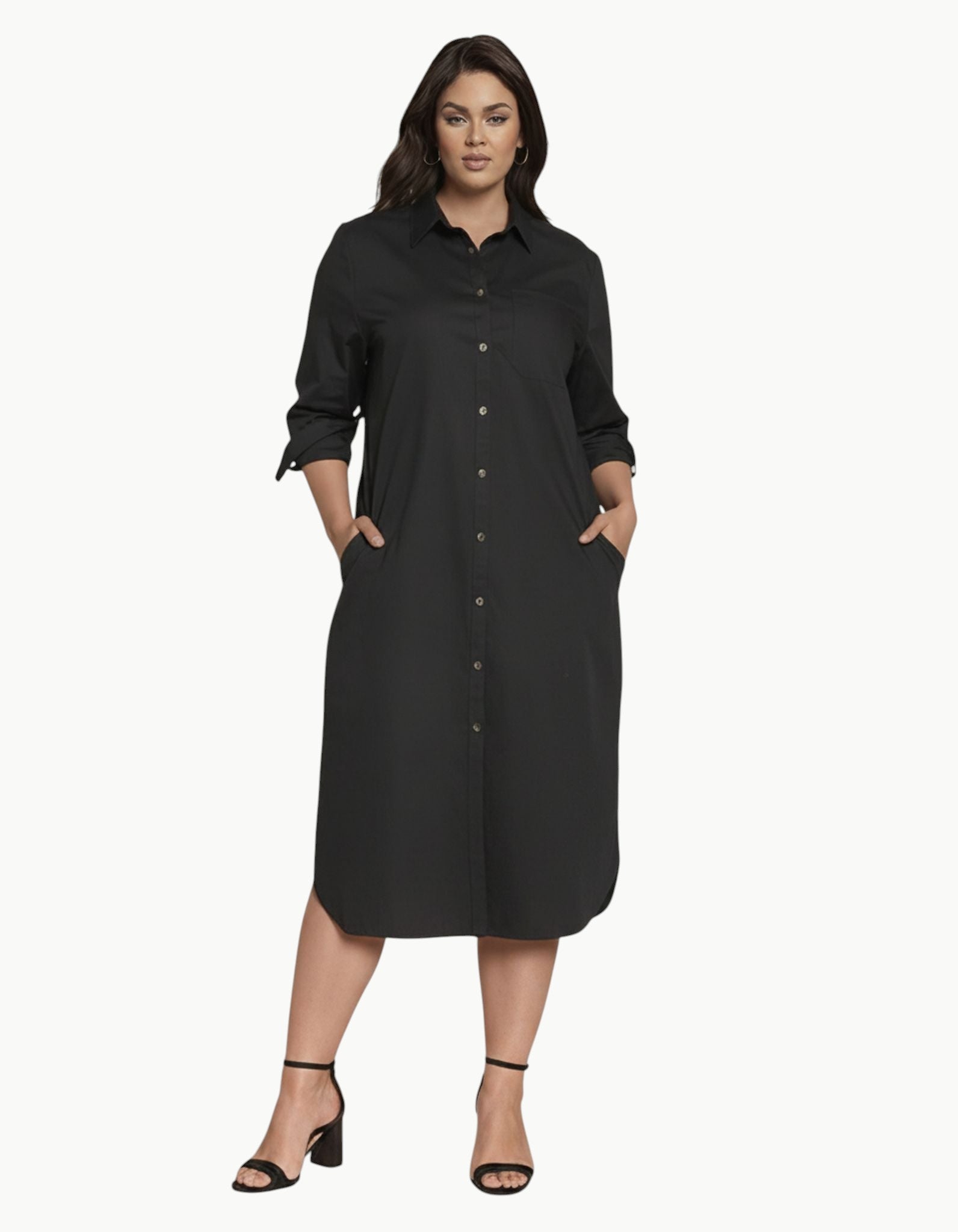 Model wearing a black Queen Anna House of Fashion Odeon stretch poplin shirtdress with pockets and contrast buttons.