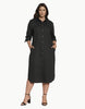 Model wearing a black Queen Anna House of Fashion Odeon stretch poplin shirtdress with pockets and contrast buttons.