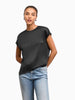 Model wearing a black Queen Anna House of Fashion washable silk charmeuse blouse with a relaxed, fluid silhouette.