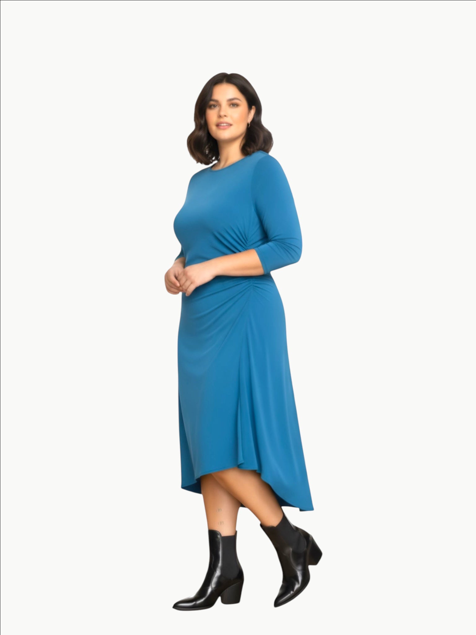 Model wearing a Queen Anna House of Fashion blue jersey cinched dress with three-quarter sleeves and black boots.