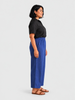 Queen Anna House of Fashion model wearing blue Universal Standard Iris linen blend straight-leg pants with elastic waist