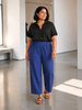 Queen Anna House of Fashion model wearing blue Universal Standard Iris linen blend straight-leg pull-on pants
