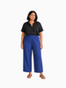 Model wearing Queen Anna House of Fashion Universal Standard blue linen-blend straight-leg pants with elastic waist