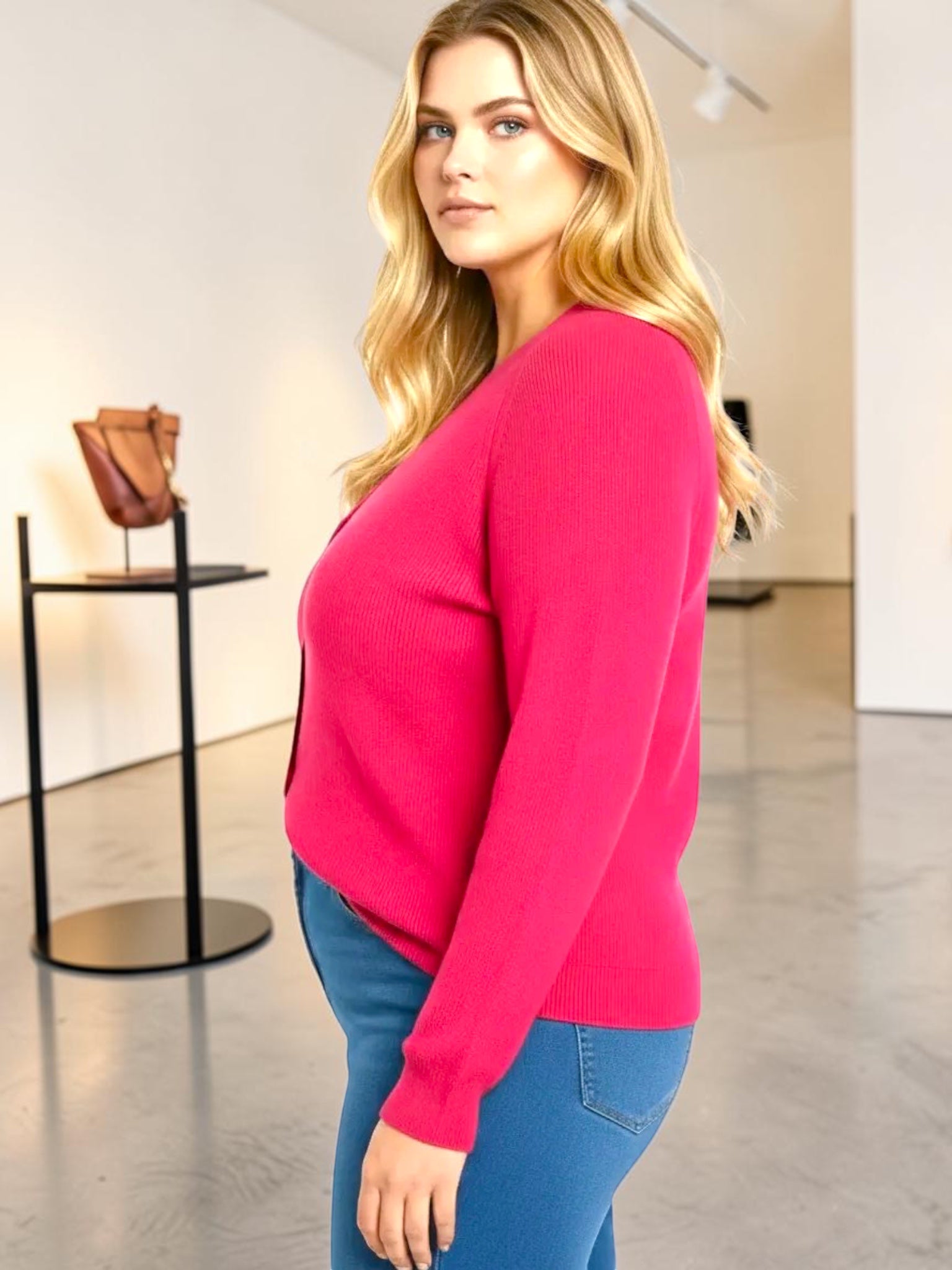 Queen Anna House of Fashion model wearing a fuchsia Better Than Wool cardigan with a skimming fit and long sleeves.