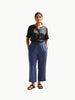 Queen Anna House of Fashion model wearing navy blue Universal Standard Iris linen blend pants with an elastic waist.