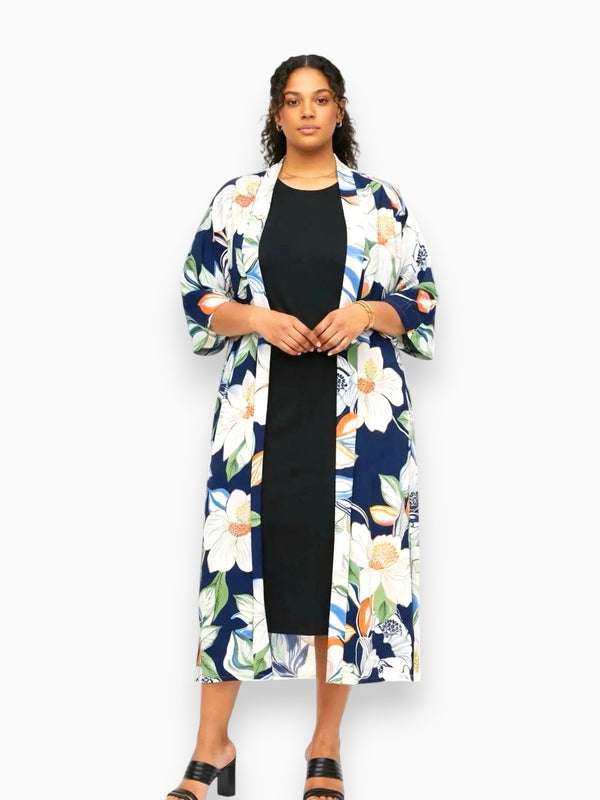 Model wearing Queen Anna House of Fashion Neu Nomads Audrey Kimono in navy floral TENCEL Modal over a black dress.