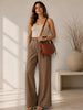 Queen Anna House of Fashion TAH Bags Nova brown full-grain leather crossbody sling bag worn by a woman