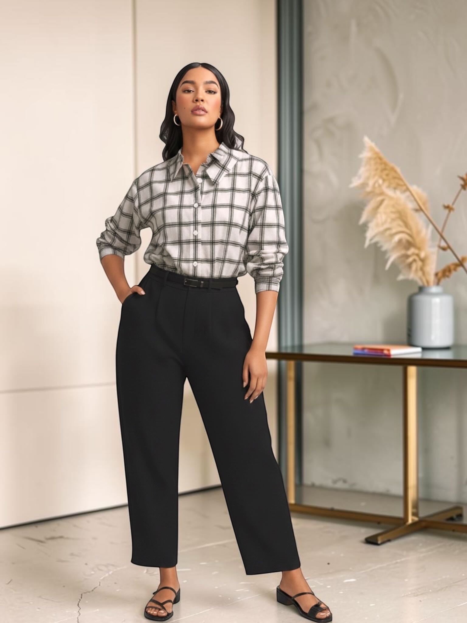 Queen Anna House of Fashion model wearing a white and black plaid stretch poplin button-down shirt with black trousers.