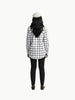 Queen Anna House of Fashion model wearing a white and black plaid poplin shirt with black trousers and a beret.