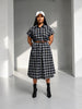 Queen Anna House of Fashion midi shirtdress in black and white plaid stretch poplin with a brown waist belt.