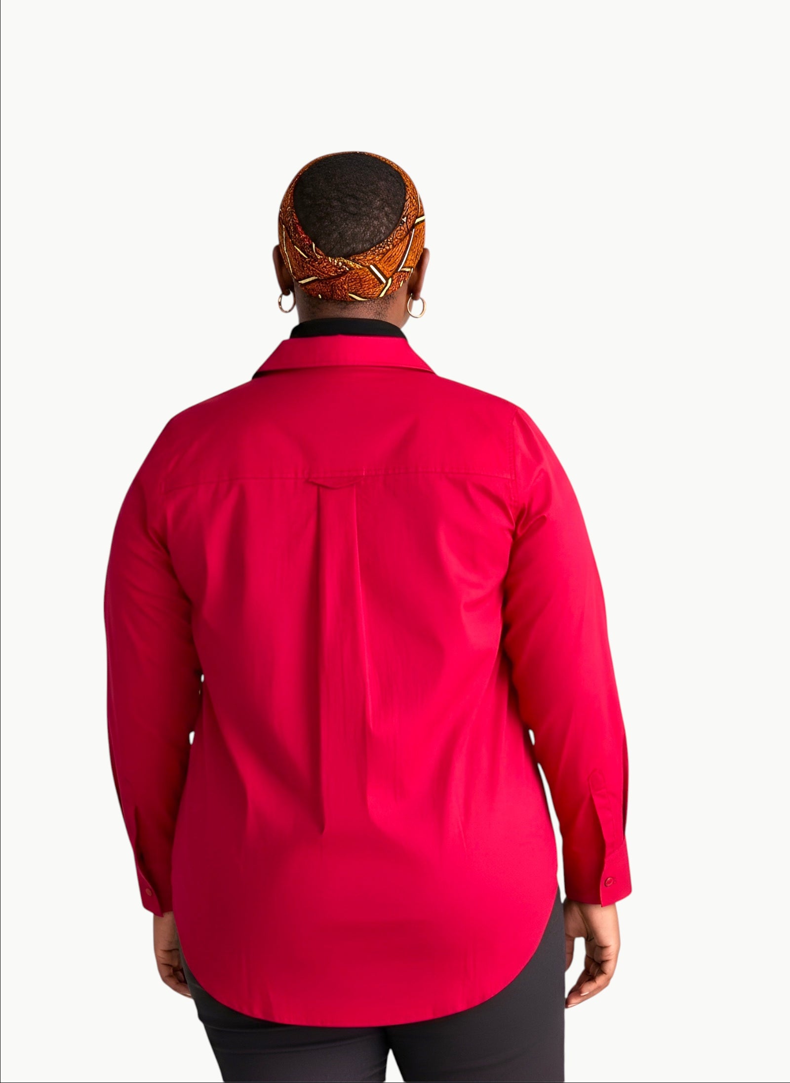 Back view of a model wearing a Queen Anna House of Fashion red stretch poplin button-down shirt with a box pleat.