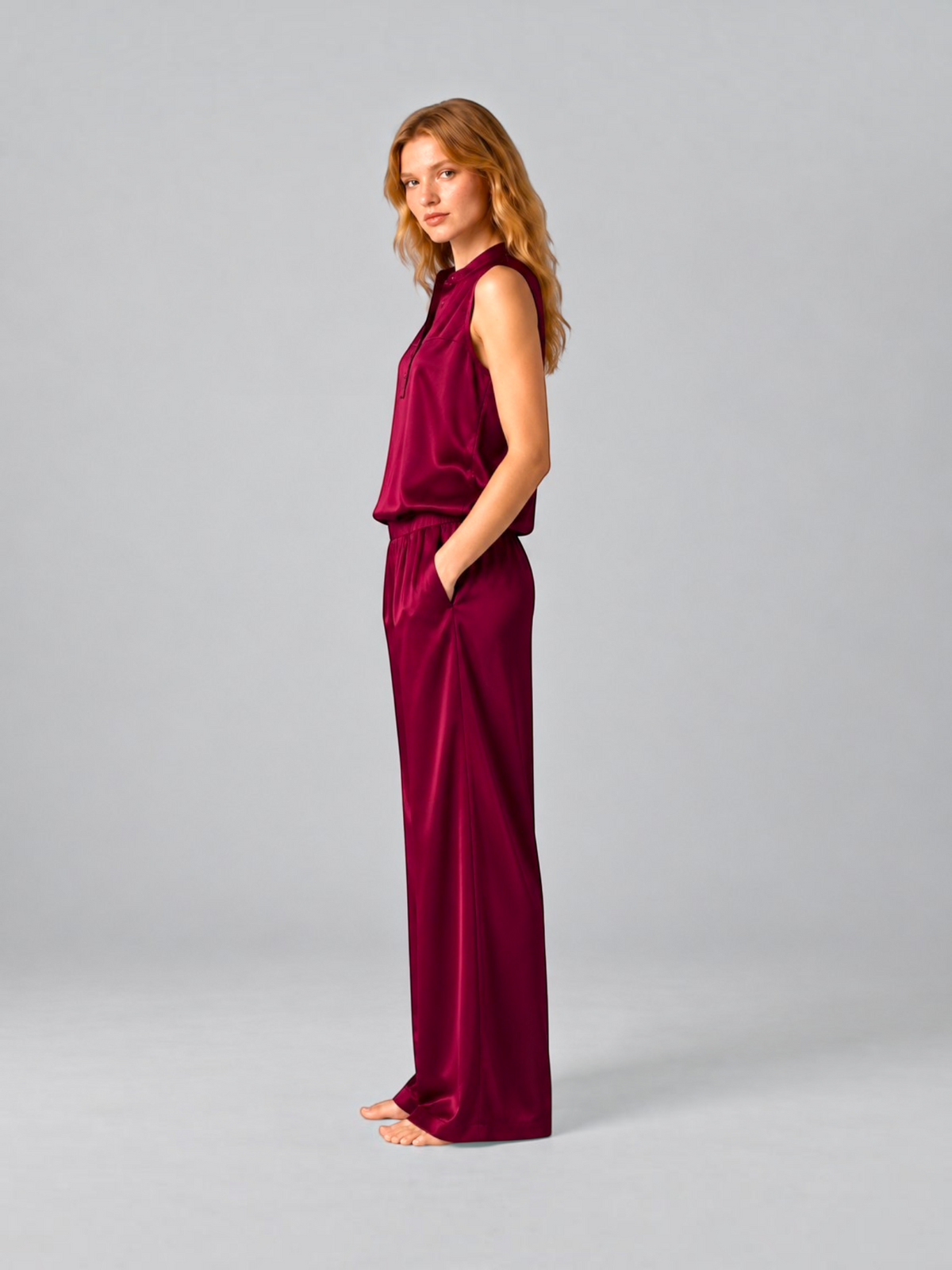 Model wearing Queen Anna House of Fashion Lunya washable silk tank and pant set in a rich calliope wine colour