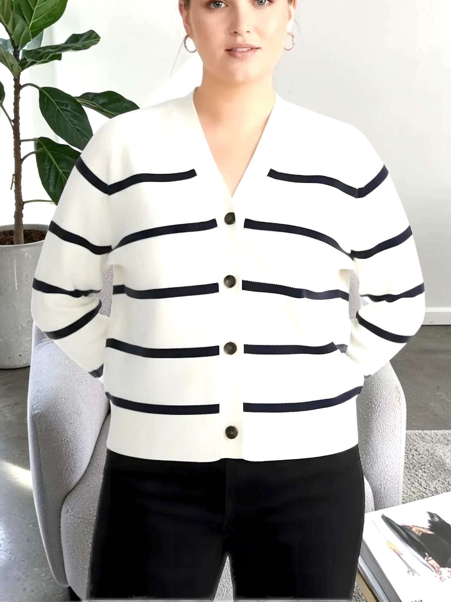 Model wearing a Queen Anna House of Fashion white and navy striped Better Than Wool V-neck button-up cardigan.