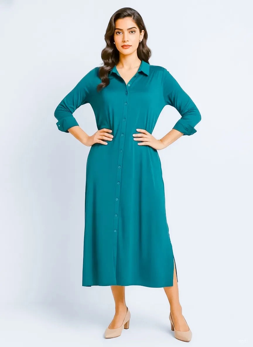 Model wearing Queen Anna House of Fashion teal liquid jersey button-down shirt dress with long sleeves and side slits.
