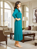 Queen Anna House of Fashion teal liquid jersey shirt dress with long sleeves and side slits worn by a model