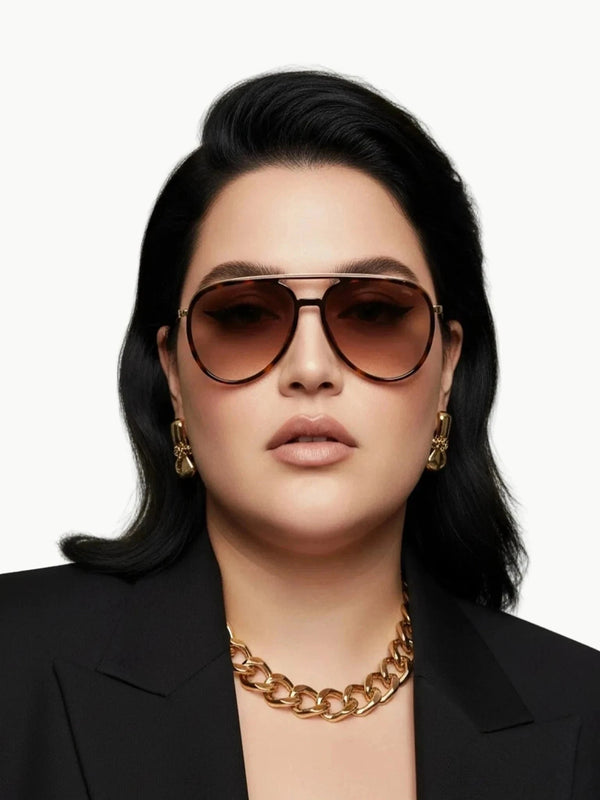 Model wearing FREYRS Eyewear Fulton Aviator Tortoise Sunglasses with black blazer and gold chain | Queen Anna House of Fashion